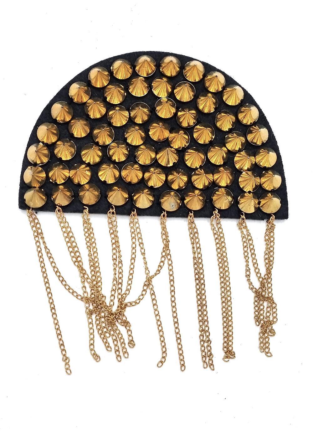 Piece of fabric with gold colored rivets