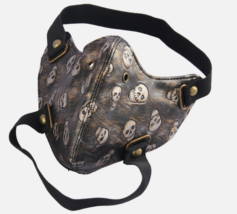 Ansiktsmask i konstläder med döskallemönster – bronsdetaljer