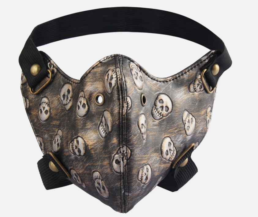 Ansiktsmask i konstläder med döskallemönster – bronsdetaljer